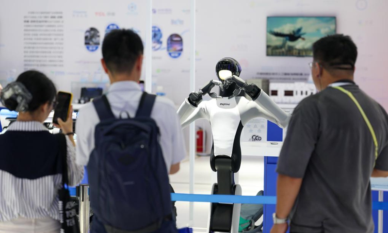 Visitors interact with a humanoid robot of PaXini, a haptic technology and humanoid robotics company, at the World Intelligence Expo 2026 in Tianjin, north China, May 28, 2026. (Xinhua/Sun Fanyue)