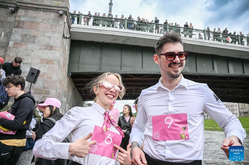 People take part in the Vilnius Pink Soup Fest in Vilnius, Lithuania, on May 30, 2026. Thousands of residents and tourists joined the annual event here on Saturday celebrating Lithuania's iconic summer dish, saltibarsciai (cold beet soup) with parades, concerts, sports activities, and other cultural events. (Photo by Alfredas Pliadis/Xinhua)