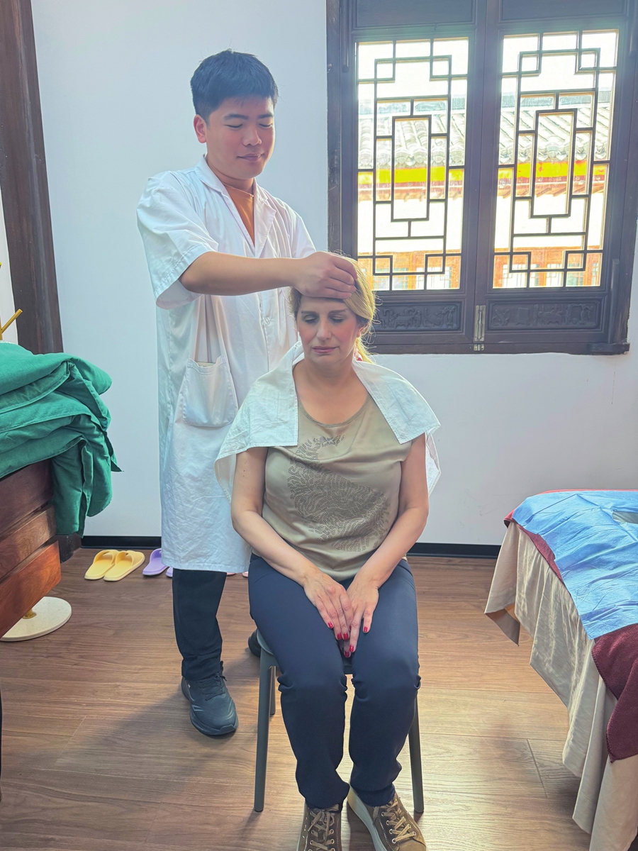 Timea Sotakova, Deputy Mayor of Michalovce, Slovakia, experiences traditional Chinese medicine in Huangshan on May 29, 2026. Photo: Courtesy of Xin'an Wellness Center