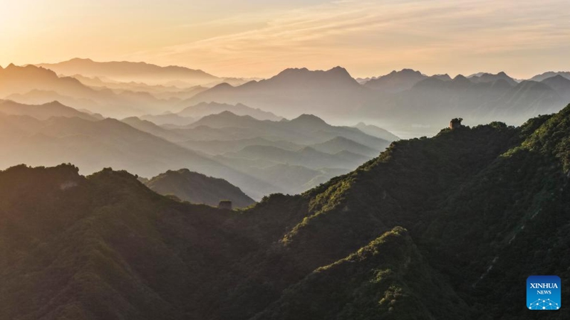 An aerial drone photo taken on June 1, 2026 shows the scenery of the Great Wall at sunrise in Qianxi County, Tangshan City in north China's Hebei Province. (Photo by Liu Mancang/Xinhua)