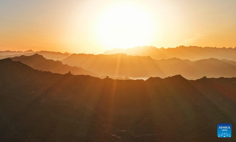 An aerial drone photo taken on June 1, 2026 shows the scenery of the Great Wall at sunrise in Qianxi County, Tangshan City in north China's Hebei Province. (Photo by Liu Mancang/Xinhua)
