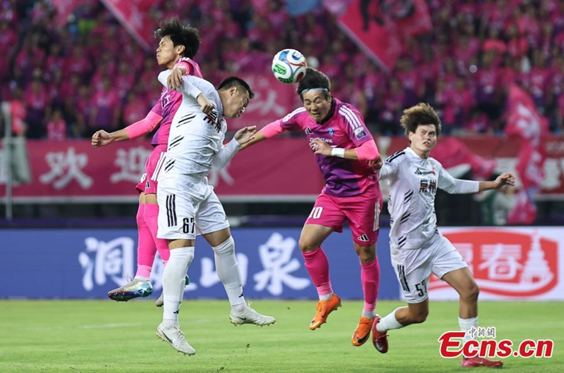 Players from Team Zhenjiang (in red and purple) and Team Changzhou (in white) compete for possession during the Jiangsu City Football League in Zhenjiang City, east China's Jiangsu Province, May 30, 2026. Photo: China News Service 