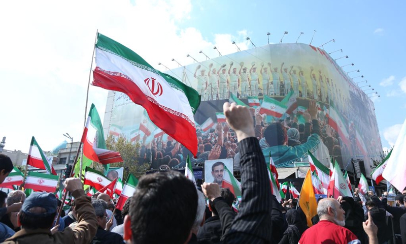 People attend a funeral ceremony for Alireza Tangsiri, chief commander of the Navy of the Islamic Revolution Guards Corps (IRGC), and other armed forces personnel killed in U.S. and Israeli strikes, in Tehran, Iran, on April 1, 2026. (Xinhua/Shadati)