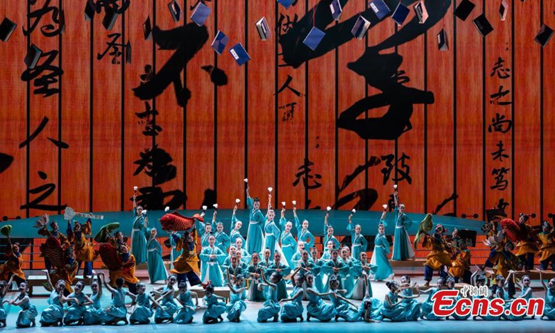 Young teenagers present a program featuring traditional Chinese cultural elements at the National Centre for the Performing Arts in Beijing. Photo: China News Service