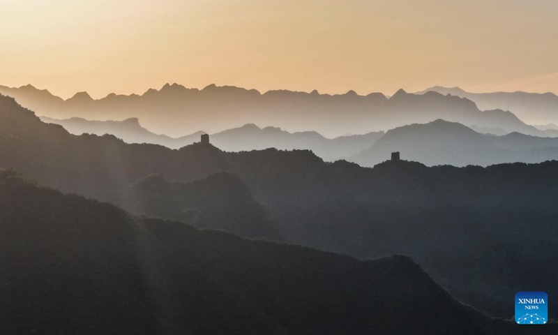 An aerial drone photo taken on June 1, 2026 shows the scenery of the Great Wall at sunrise in Qianxi County, Tangshan City in north China's Hebei Province. (Photo by Liu Mancang/Xinhua)