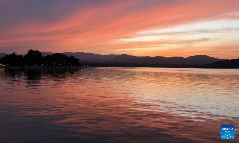 This photo taken on May 31, 2026 shows a view of the sunset glow at the Summer Palace in Beijing, capital of China. (Photo by Wang Chutian/Xinhua)