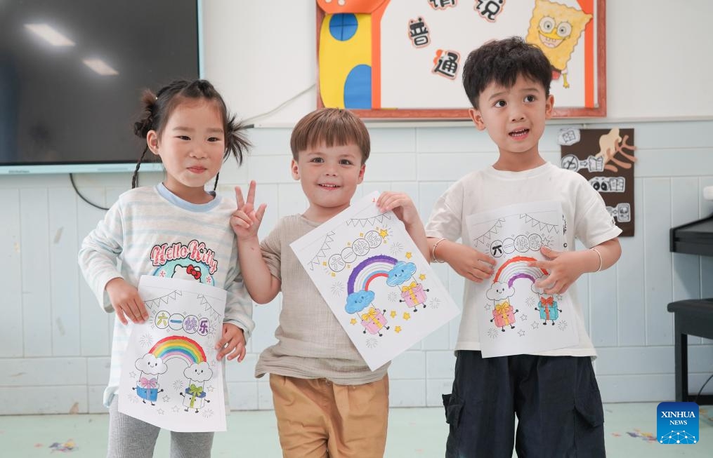 Maya (C) and her classmates participate in a Children's Day event at the kindergarten in Dongting Town of Guangde City, east China's Anhui Province, May 29, 2026. Four-year-old Maya Ivanou moved to China with her parents in 2023. The family settled in Dongting Town, home to the Yangtze River Delta International Equestrian Center. Maya's mother, Aleksandra Timofeeva, better known as Sasha, is an equestrian from Russia and her father, Vasil Ivanou, a coach from Belarus. (Photo: Xinhua)