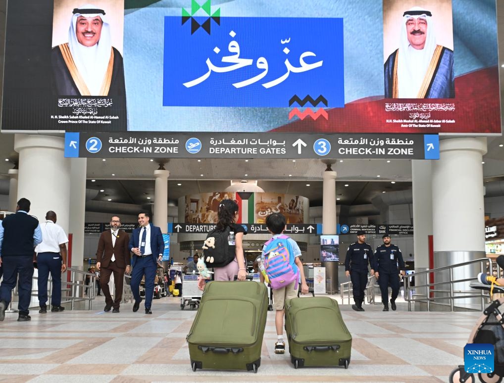 Passengers head towards the departure gate in Terminal 1 at Kuwait International Airport in Farwaniya Governorate, Kuwait, June 1, 2026. Kuwait International Airport resumed operations on Monday, receiving and operating flights from Arab and international airlines as part of a phased reopening plan following the completion of repair and upgrade work. (Photo: Xinhua)
