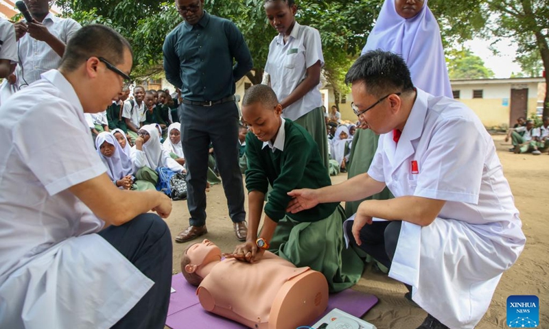 Members of the 28th batch of the Chinese medical team in mainland Tanzania instruct a student on cardiopulmonary resuscitation (CPR) techniques at a school in Dar es Salaam, Tanzania, June 1, 2026. The 28th batch of the Chinese medical team in mainland Tanzania on Monday held a free medical outreach event at a school in Dar es Salaam, providing free consultations and public health education to teachers and students. (Photo: Xinhua)
