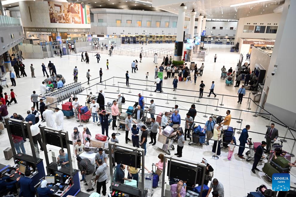 Passengers queue for check-in in Terminal 1 at Kuwait International Airport in Farwaniya Governorate, Kuwait, June 1, 2026. Kuwait International Airport resumed operations on Monday, receiving and operating flights from Arab and international airlines as part of a phased reopening plan following the completion of repair and upgrade work. (Photo: Xinhua)