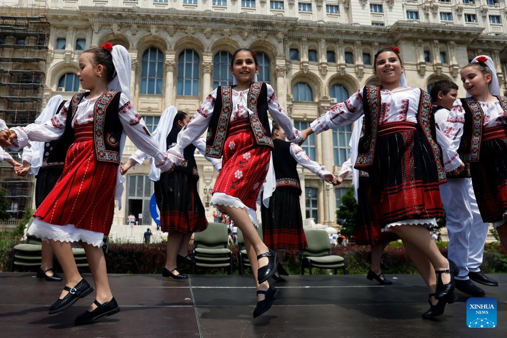 Children perform a traditional dance during an open door event marking International Children's Day at Romania's Parliament Palace in Bucharest, Romania, June 1, 2026. (Photo: Xinhua)