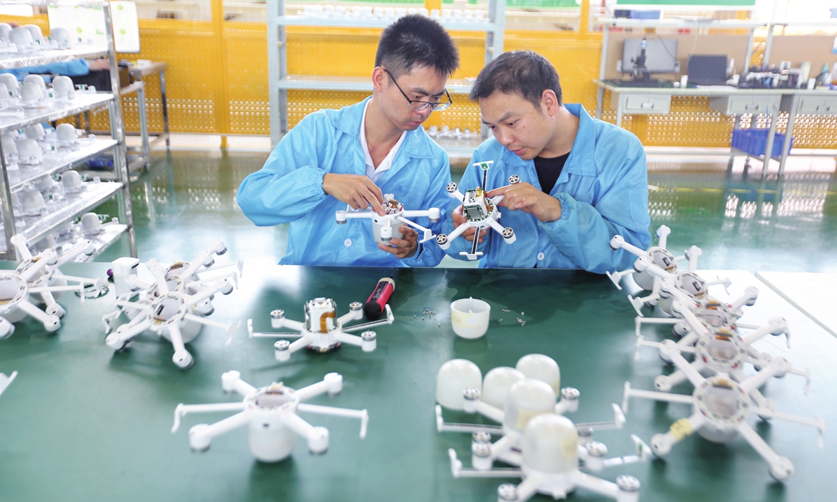 Workers assemble drones at a production workshop of a company in Leshan, Southwest China's Sichuan Province, on June 2, 2026. Latest industry data show that in 2025, China's civil drone industry recorded a total output value of 176.1 billion yuan ($26.03 billion), up about 20 percent year-on-year, of which consumer-grade drones accounted for 50.2 billion yuan. Photo: VCG