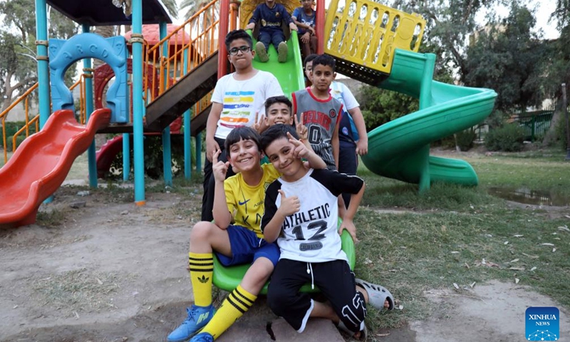 Boys play on a slide at a park in Baghdad, Iraq, on May 31, 2026. June 1 is International Children's Day. (Photo: Xinhua)