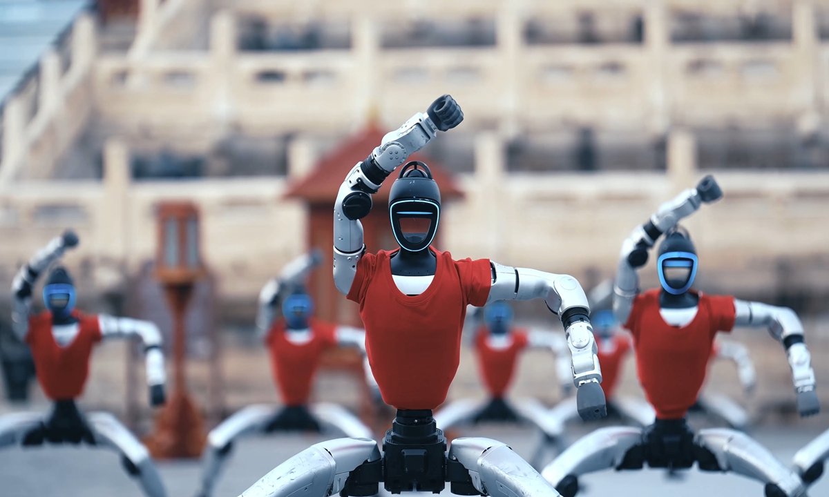 Unitree's G1 humanoid robots performe a synchronized martial arts demonstration in front of the Hall of Prayer for Good Harvests at the Temple of Heaven in Beijing. Photo: Screenshot of Unitree's video clip