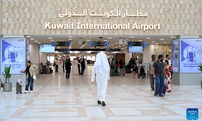 Passengers head towards the departure gate in Terminal 1 at Kuwait International Airport in Farwaniya Governorate, Kuwait, June 1, 2026. Kuwait International Airport resumed operations on Monday, receiving and operating flights from Arab and international airlines as part of a phased reopening plan following the completion of repair and upgrade work. (Photo: Xinhua)
