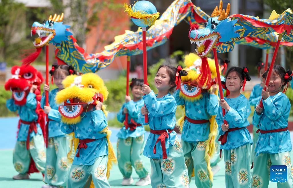 Children perform a dragon and lion dance at a kindergarten in Taizhou, east China's Jiangsu Province, June 1, 2026. International Children's Day was celebrated across China on Monday. (Photo: Xinhua)