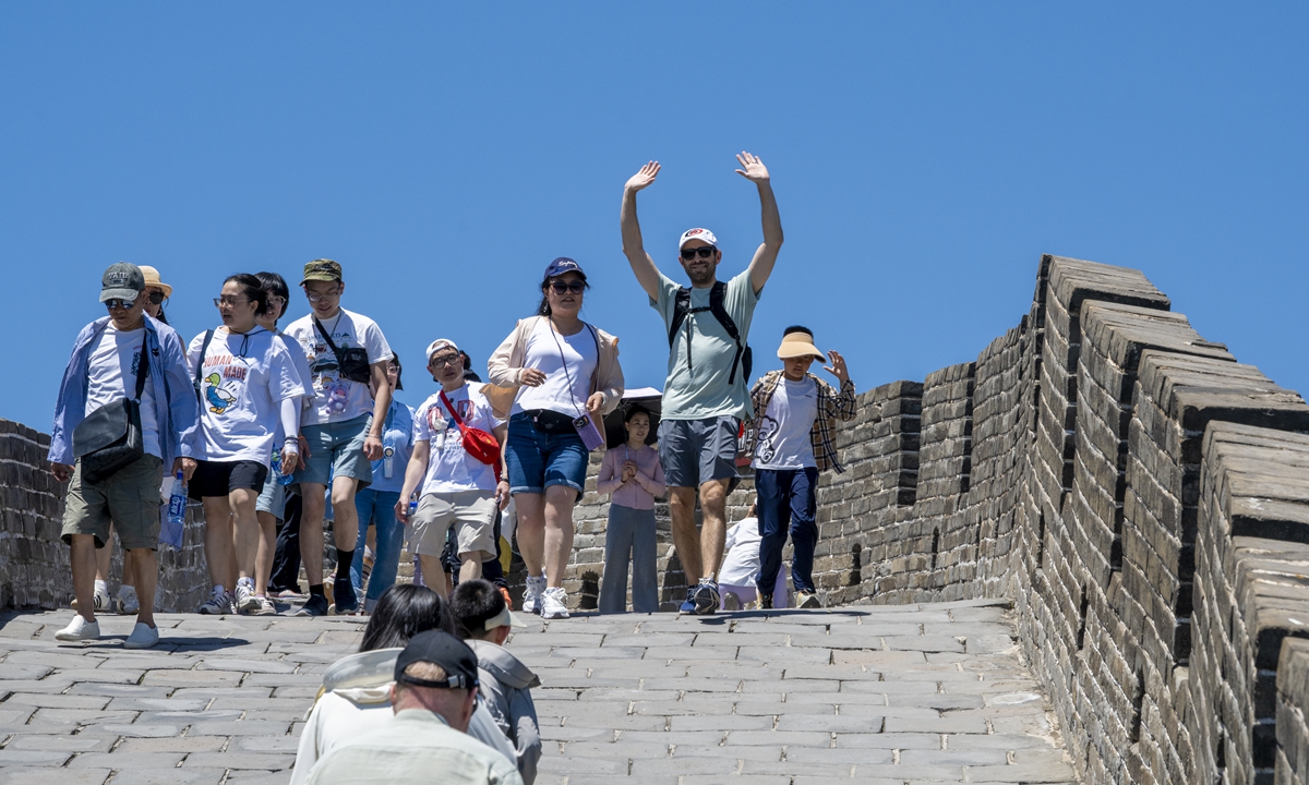 Foreign visitors explore the Badaling section of the Great Wall and experience its centuries-old heritage up close in Beijing on June 1, 2026. Photo: VCG