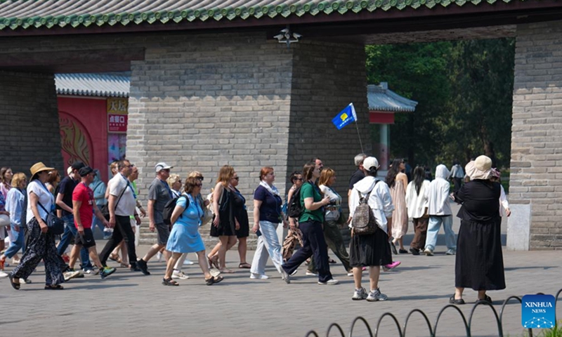 Foreign tourists visit the Temple of Heaven Park in Beijing, capital of China, May 12, 2026. Beijing received a total of 2.667 million inbound tourists in the first five months of this year, up 35.3 percent year-on-year, demonstrating the rising popularity of China Travel. As of May 11, the number of exits and entries by foreign nationals at Beijing ports had surpassed 2.55 million, accounting for 32 percent of the total inbound and outbound passenger volume and registering a year-on-year growth of 33.6 percent. (Photo: Xinhua)