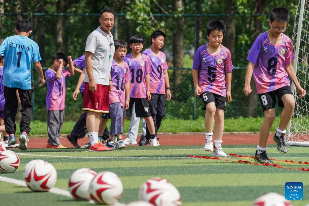 Children attend a football training session at Huikou Central Primary School in Susong County of Anqing, east China's Anhui Province, May 26, 2026. (Photo: Xinhua)