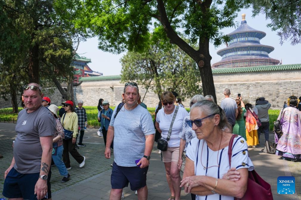 Foreign tourists visit the Temple of Heaven Park in Beijing, capital of China, May 12, 2026. Beijing received a total of 2.667 million inbound tourists in the first five months of this year, up 35.3 percent year-on-year, demonstrating the rising popularity of China Travel. As of May 11, the number of exits and entries by foreign nationals at Beijing ports had surpassed 2.55 million, accounting for 32 percent of the total inbound and outbound passenger volume and registering a year-on-year growth of 33.6 percent. (Photo: Xinhua)