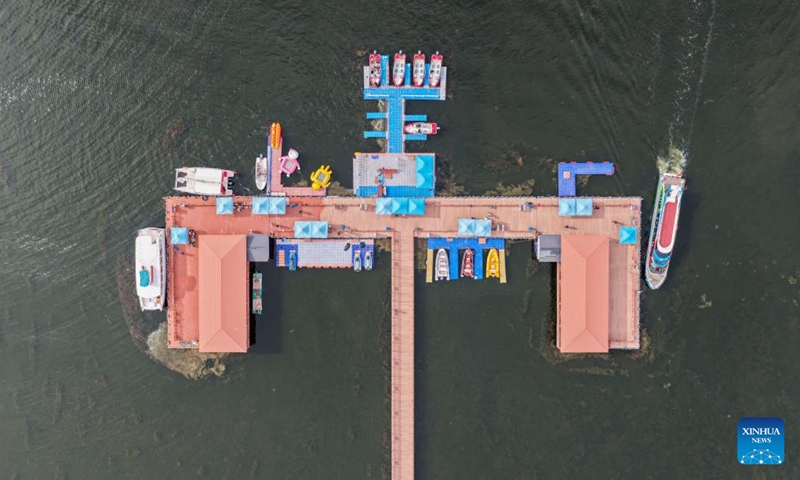An aerial drone photo taken on May 31, 2026 shows a marina at Ulan Suhai Lake in Urad Front Banner of Bayannur, north China's Inner Mongolia Autonomous Region. The Ulan Suhai Lake is the largest freshwater lake in the Yellow River basin. In recent years, local authorities have taken multiple measures to improve the ecology of the lake area. By making good use of the water replenishment from the Yellow River while strictly controlling sources of pollution, the lake's ecology has been improving year by year. (Photo: Xinhua)