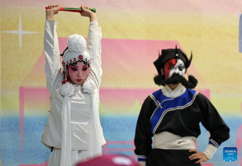 Lyu Jinshuang (L), a Qinqiang Opera performer from the Youth Troupe of Xi'an Performing Arts Group, warms up for a performance in Xi'an, northwest China's Shaanxi Province, May 30, 2026. Qinqiang Opera, a Chinese folk opera genre originating in the Western Zhou Dynasty (1046 B.C.-771 B.C.), continues to thrive in a vast region of northwest China and was added to China's intangible cultural heritage list in 2006. (Photo: Xinhua)