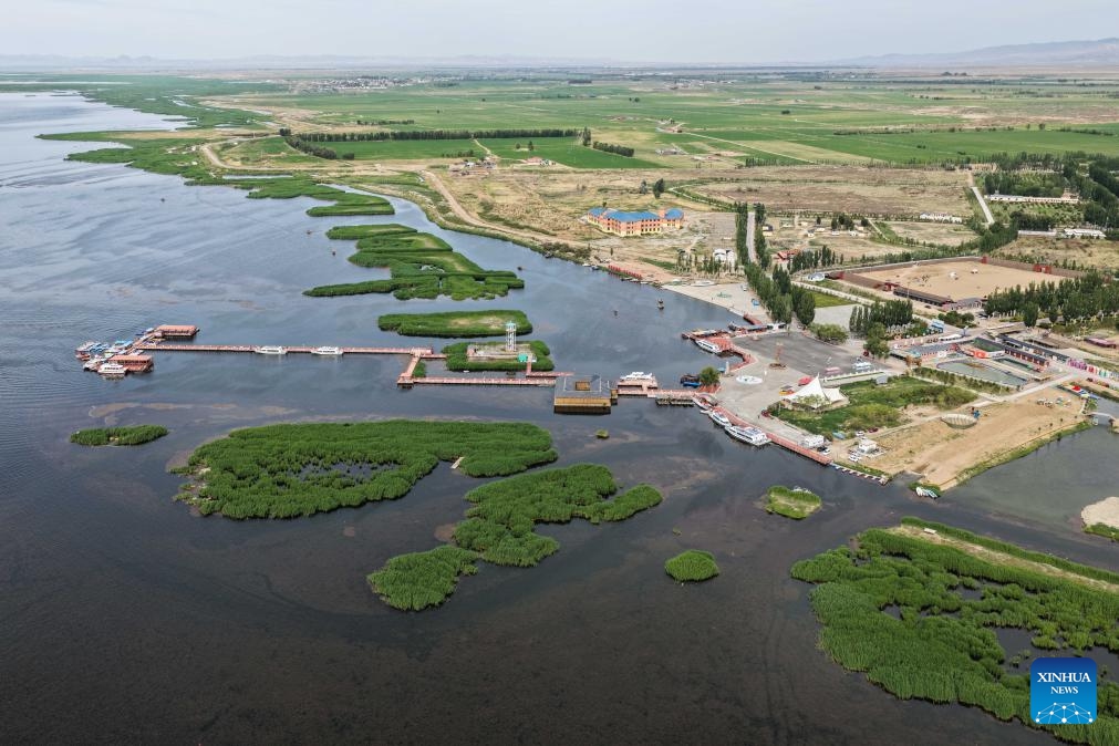 An aerial drone photo taken on May 31, 2026 shows a view of Ulan Suhai Lake in Urad Front Banner of Bayannur, north China's Inner Mongolia Autonomous Region. The Ulan Suhai Lake is the largest freshwater lake in the Yellow River basin. In recent years, local authorities have taken multiple measures to improve the ecology of the lake area. By making good use of the water replenishment from the Yellow River while strictly controlling sources of pollution, the lake's ecology has been improving year by year. (Photo: Xinhua)