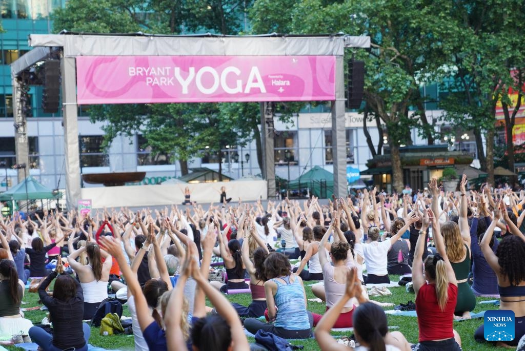 People attend an open-air yoga class at Bryant Park in New York, the United States, on June 3, 2026. An open-air yoga class was held on Wednesday at Bryant Park in New York, starting the open air activities of this summer season. (Photo: Xinhua)