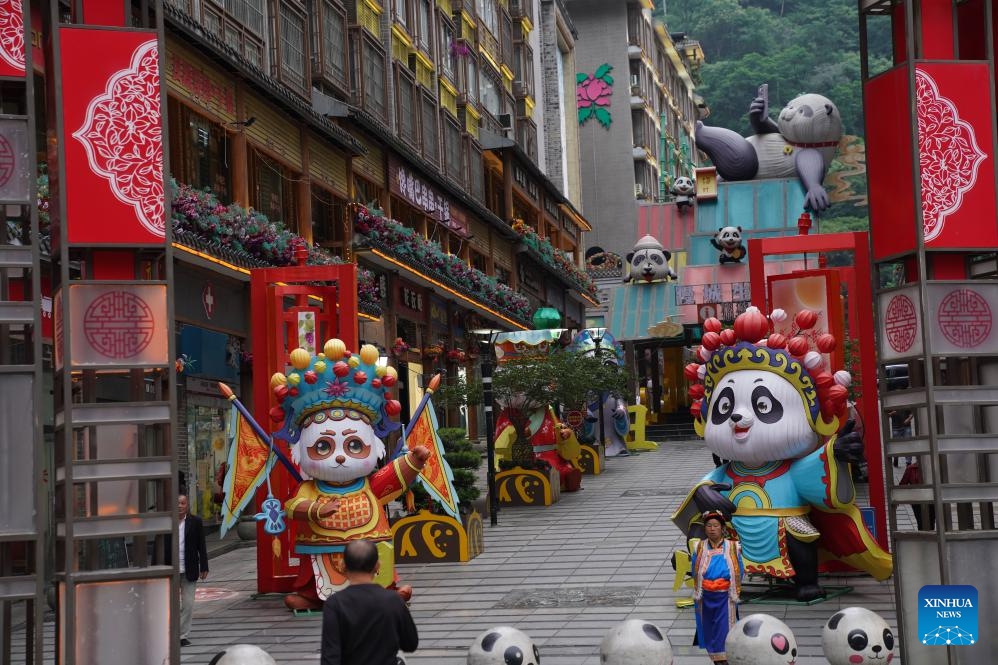 This photo taken on June 2, 2026 shows giant panda-themed decorations in Muping Town of Baoxing County of Ya'an City, southwest China's Sichuan Province. The giant panda ancient town, a national 4A-level scenic spot, is located in Muping Town of Baoxing County. Currently, more than 80 percent of the county area forms part of the Giant Panda National Park, which was established in 2021 and spans 27,000 square km across three provinces -- Sichuan, Shaanxi and Gansu. (Photo: Xinhua)