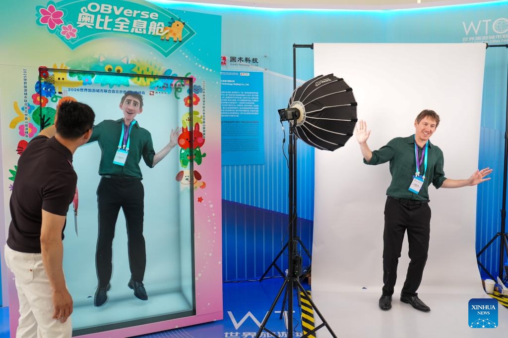 A guest experiences the technology of replicated digital avatar at Zhongguancun International Innovation Center on the sidelines of The 2026 Global Mayors Dialogue in Beijing, capital of China, June 2, 2026. The 2026 Global Mayors Dialogue - Beijing opened here on Tuesday, during which representatives from 56 countries and regions, and 73 cities discussed on the digital and intelligent development of city tourism and a better city life prospect brought by the transformation and upgrading of tourism. (Photo: Xinhua)