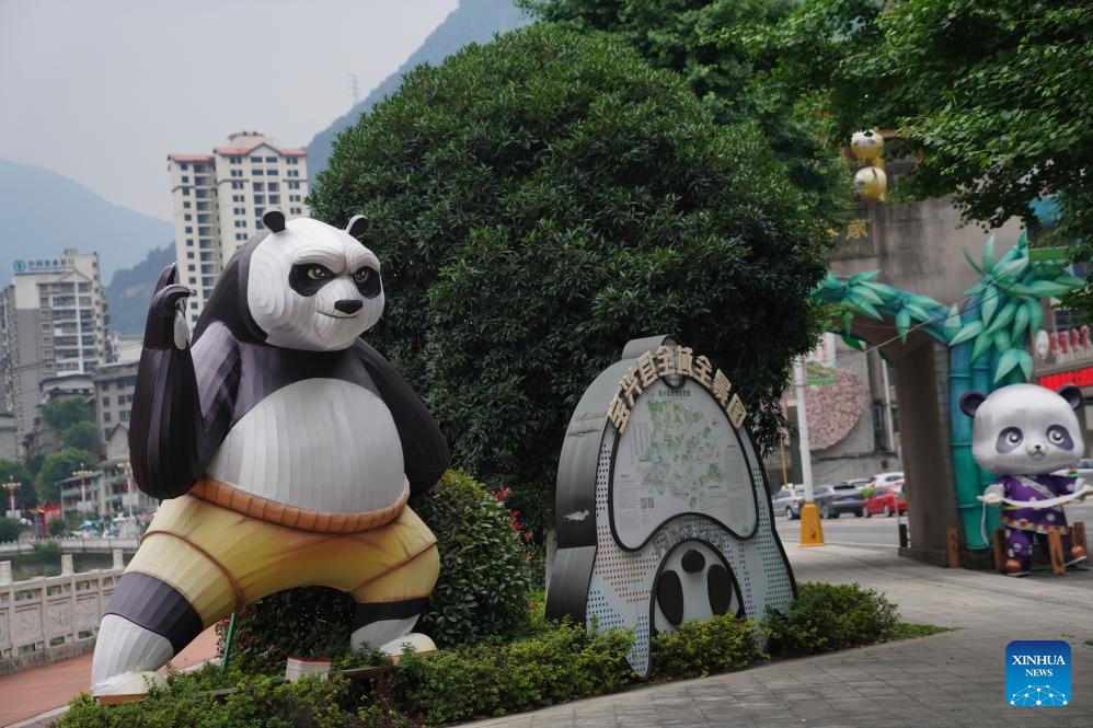 This photo taken on June 2, 2026 shows giant panda-themed decorations in Muping Town of Baoxing County of Ya'an City, southwest China's Sichuan Province. The giant panda ancient town, a national 4A-level scenic spot, is located in Muping Town of Baoxing County. Currently, more than 80 percent of the county area forms part of the Giant Panda National Park, which was established in 2021 and spans 27,000 square km across three provinces -- Sichuan, Shaanxi and Gansu. (Photo: Xinhua)