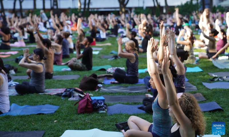 People attend an open-air yoga class at Bryant Park in New York, the United States, on June 3, 2026. An open-air yoga class was held on Wednesday at Bryant Park in New York, starting the open air activities of this summer season. (Photo: Xinhua)