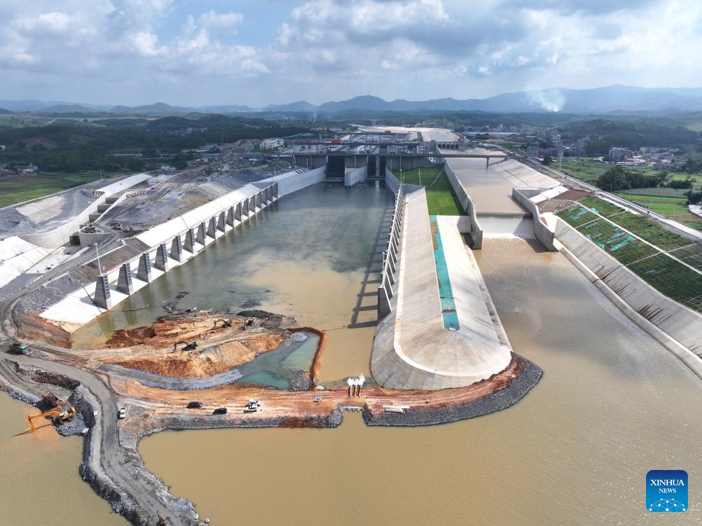 An aerial drone photo taken on June 3, 2026 shows water being pumped into the Qishi hub on the Pinglu Canal in south China's Guangxi Zhuang Autonomous Region. Water began flowing through the final sections of the Pinglu Canal on Wednesday, bringing the long-awaited shortcut to the coast in south China a step closer to opening for navigation. As water was pumped into the canal on Wednesday morning, the 134.2-kilometer waterway has now achieved full-channel connectivity and entered the final phase ahead of its expected inauguration in September. (Photo: Xinhua)