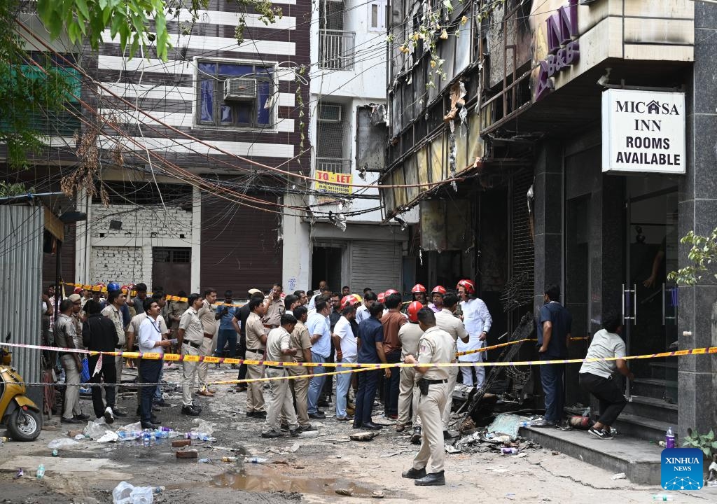 Indian policemen and officials inspect the site of a hotel fire in New Delhi, India, June 3, 2026. Up to 21 people were killed in a hotel fire here on Wednesday, local media reported. Over 35 people were rescued and later admitted to three different hospitals, a fire department official said. (Photo: Xinhua)