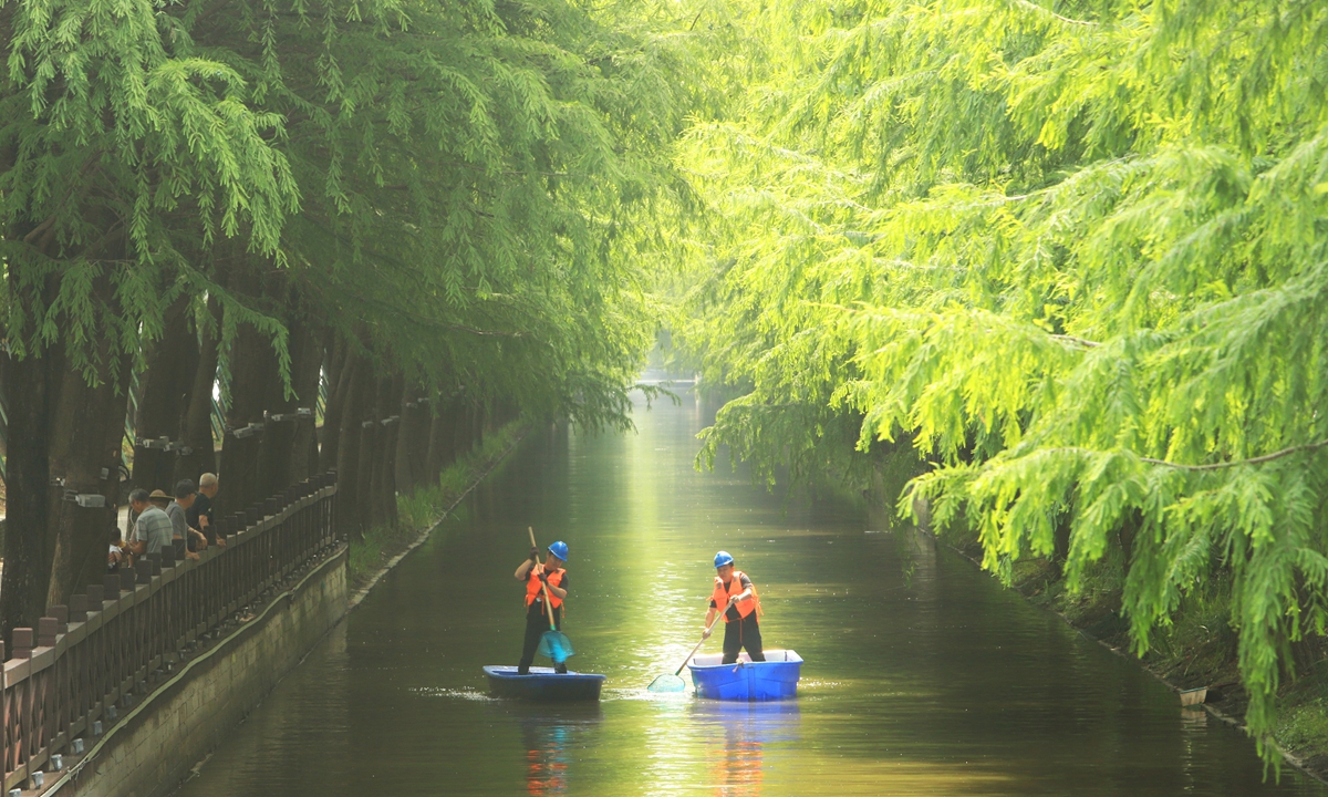 Two cleaners from the Luqiao district in Taizhou, East China's Jiangsu Province, carry out routine river cleanup on June 4, 2026, ahead of World Environment Day falling on June 5. Photo: VCG