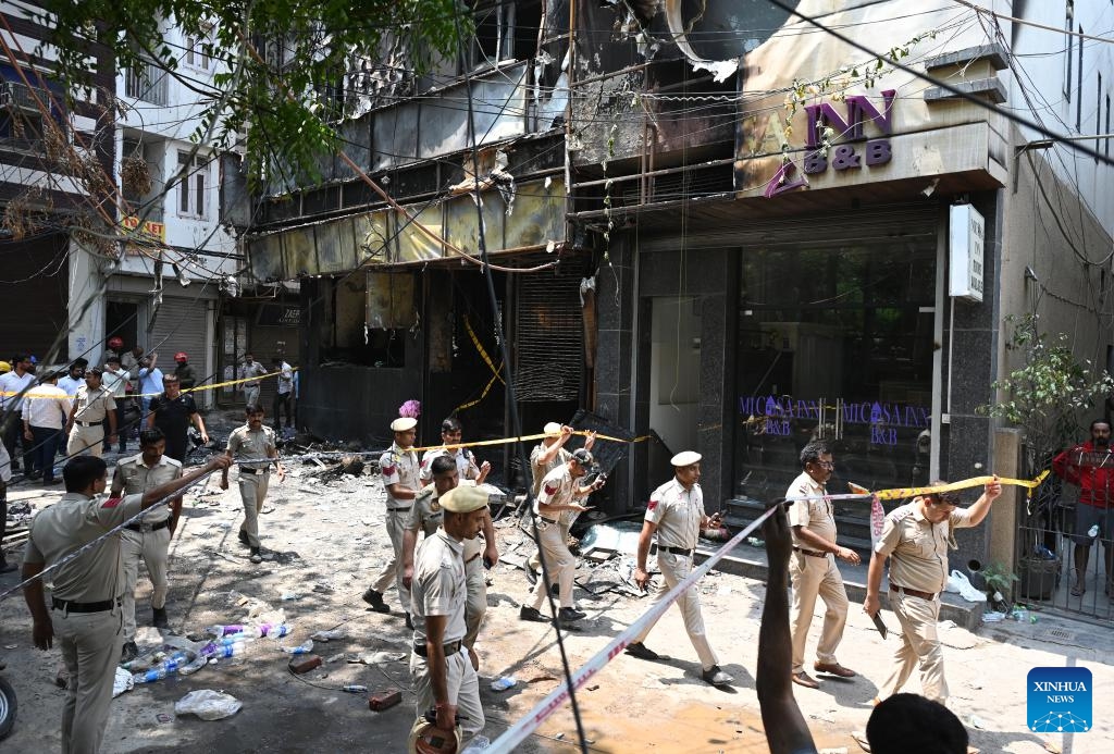 Indian policemen are pictured at the site of a hotel fire in New Delhi, India, June 3, 2026. Up to 21 people were killed in a hotel fire here on Wednesday, local media reported. Over 35 people were rescued and later admitted to three different hospitals, a fire department official said. (Photo: Xinhua)