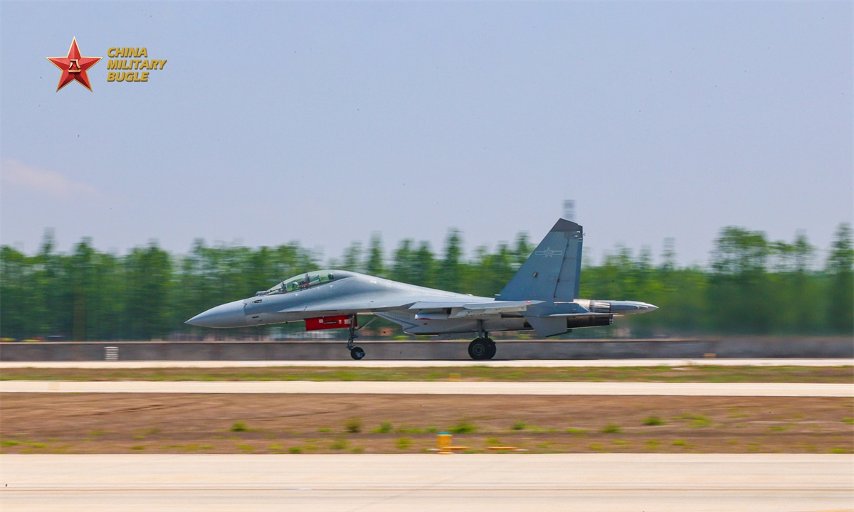 A J-16 fighter jet attached to an aviation troop with the air force under the Chinese PLA Eastern Theater Command speeds up for takeoff during a recent multi-sortie flight training exercise. (eng.chinamil.com.cn/Photo by Xing Zhitao)