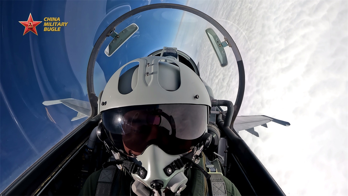 A pilot assigned to an aviation troop with the air force under the Chinese PLA Eastern Theater Command performs a maneuver during a recent multi-sortie flight training exercise. (eng.chinamil.com.cn/Photo by Xing Zhitao)