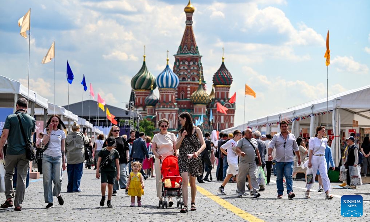 People visit the 12th Red Square Book Festival in Moscow, Russia, on June 4, 2026. The 12th Red Square Book Festival kicked off here Thursday, showcasing over 150,000 books from more than 400 participating publishers. Running through to June 7, the festival will also feature musical performances, literary musicals, book launches, and discussion panels. (Xinhua/Feng Kaihua)