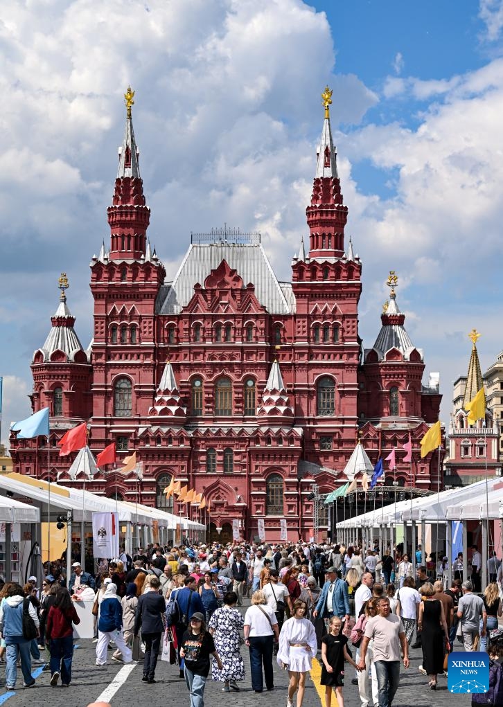 People visit the 12th Red Square Book Festival in Moscow, Russia, on June 4, 2026. The 12th Red Square Book Festival kicked off here Thursday, showcasing over 150,000 books from more than 400 participating publishers. Running through to June 7, the festival will also feature musical performances, literary musicals, book launches, and discussion panels. (Xinhua/Feng Kaihua)