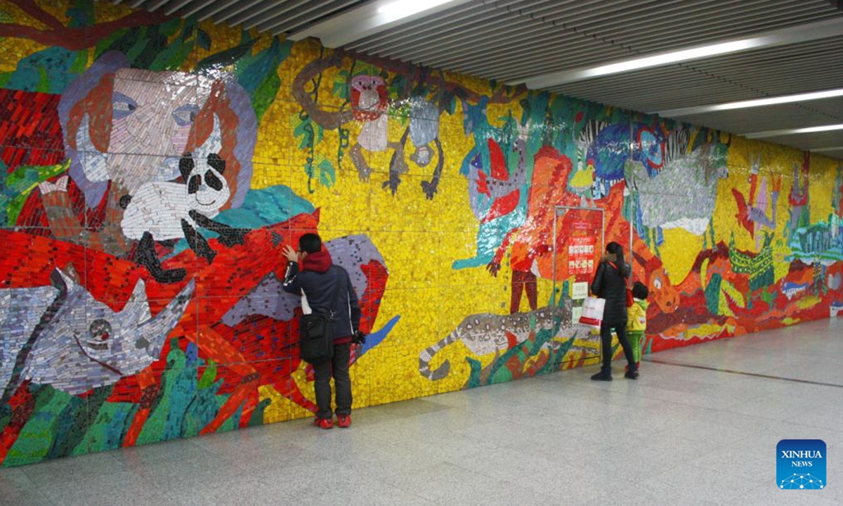 This undated file photo shows the colored glaze mural Animal World by Sun Yunhao at the Beijing Zoo Station on Subway Line 4 in Beijing, capital of China. (Xinhua/Zhu Zheng)