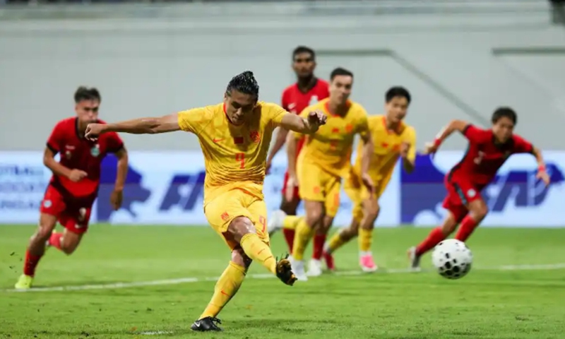 China's Zhang Yuning converts a penalty during the friendly against Singapore on June 5, 2026.