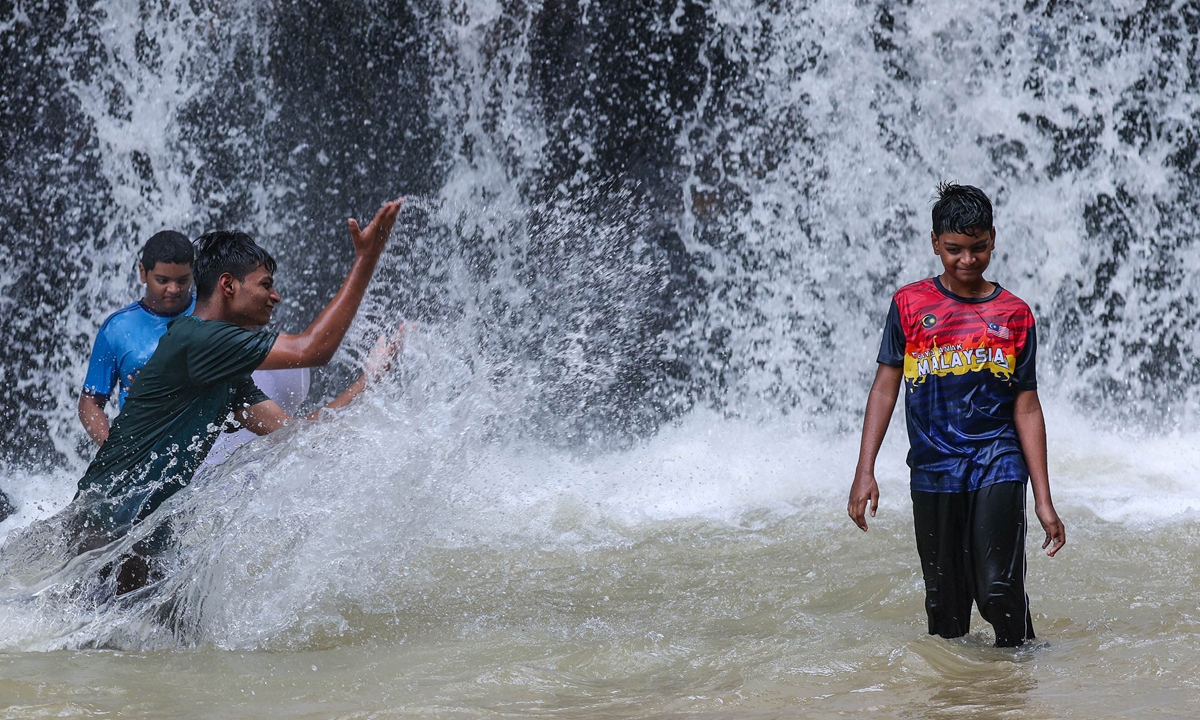 Boys cool off in a waterfall at Hulu Selangor, Malaysia, on June 5, 2026. Malaysia is facing an intensifying El Ni?o threat amid record heat, local media outlet The Vibes reported. Photo: VCG