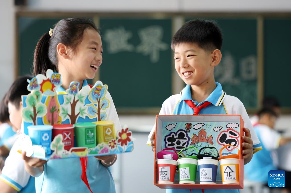 Pupils display toys they made with recycled materials at a primary school in Tancheng County, Linyi City of east China's Shandong Province, June 5, 2026. Friday marks World Environment Day. (Photo: Xinhua)
