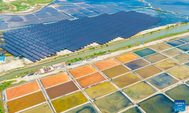 An aerial drone photo taken on June 2, 2026 shows a photovoltaic power project side by side with salt fields in Rongcheng City, east China's Shandong Province. Shandong Province has seen the development in its photovoltaic power sector with complementary modes in light of local conditions over recent years. These innovative modes blaze a path for three wins for clean energy exploration, ecological environment protection, and economic benefits. (Photo: Xinhua)