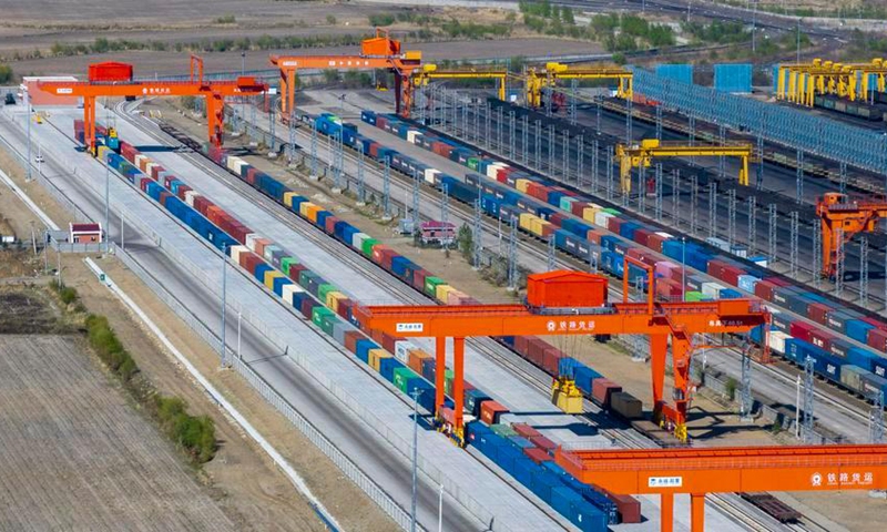 A drone photo taken on May 13, 2026 shows China-Europe freight trains doing refitting work at the Tongjiang North Station refitting yard in Tongjiang, northeast China's Heilongjiang Province. (Photo by Wu Yunan/Xinhua)