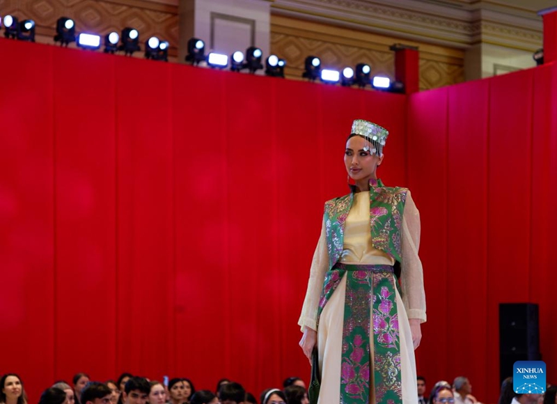 A model showcases a designer's creations at a fashion show during the Turkmen Textile Expo 2026 in Ashgabat, Turkmenistan, June 5, 2026. (Photo by Cui Jiaxin/Xinhua)