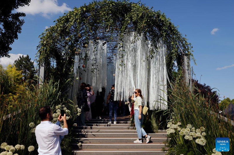 Visitors take pictures during the opening day of the 4th edition of West Side Flower Fest in Bucharest, Romania, on June 5, 2026. (Photo by Cristian Cristel/Xinhua)