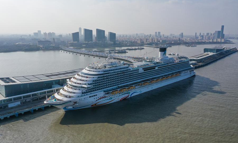 An aerial drone photo taken on Jan. 1, 2024 shows the large cruise ship Adora Magic City at the Shanghai Wusongkou International Cruise Terminal in east China's Shanghai. (Xinhua/Ding Ting)