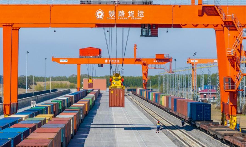 A drone photo taken on May 13, 2026 shows a China-Europe freight train doing refitting work at the Tongjiang North Station refitting yard in Tongjiang, northeast China's Heilongjiang Province. (Photo by Wu Yunan/Xinhua)